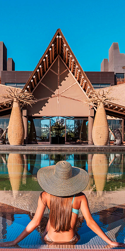  Girl in the Volcan pool in front of the lodge of the Hotel Lopesan Baobab Resort in Meloneras, Gran Canaria 